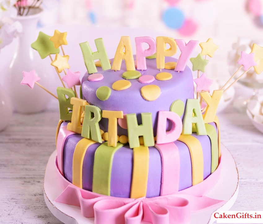 Delicious birthday cake on table on brick wall background - CakenGifts.in